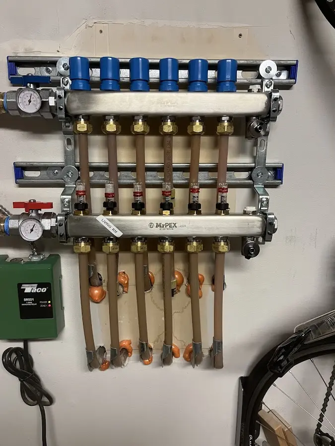 Plumber performing Water Heater Repair at a residential property in Carrollton